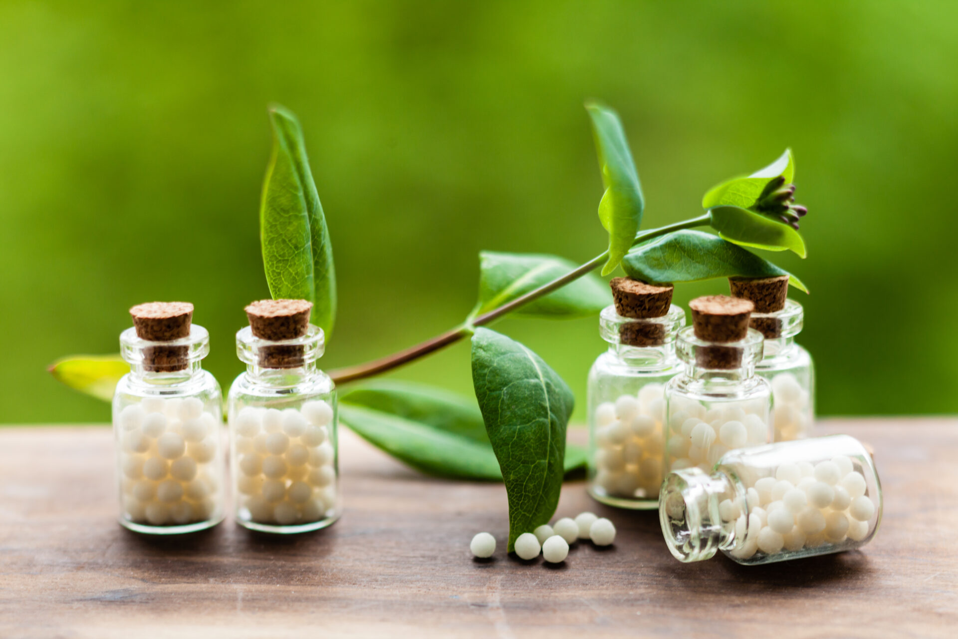 Homeopathic remedies in glass bottles.